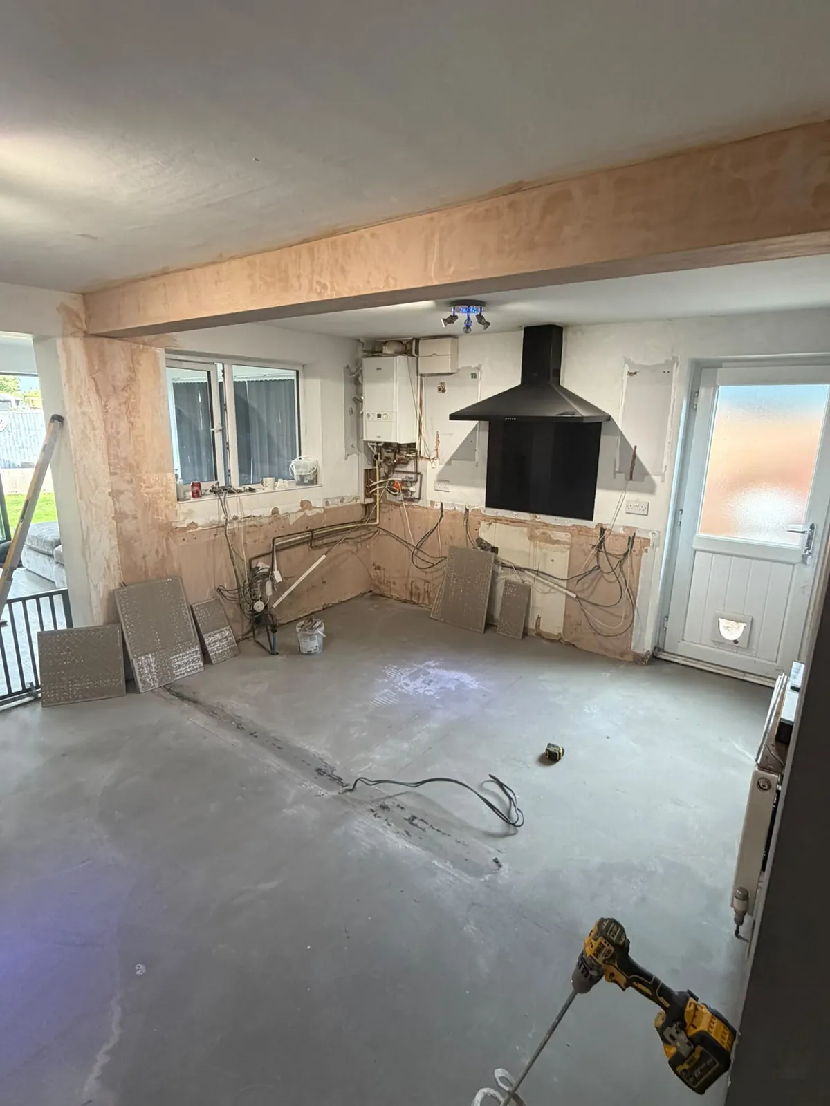 Kitchen stripped back to bare walls and floor before renovation in Selby